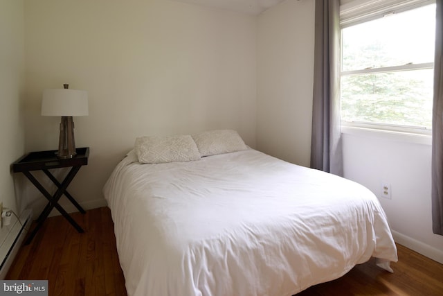 1581 W Branch Rd, State College, PA 16801 - bedroom featuring wood finished floors, a baseboard heating unit, and baseboards