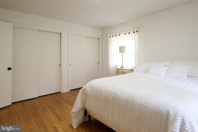 1581 W Branch Rd, State College, PA 16801 - bedroom featuring two closets and wood finished floors