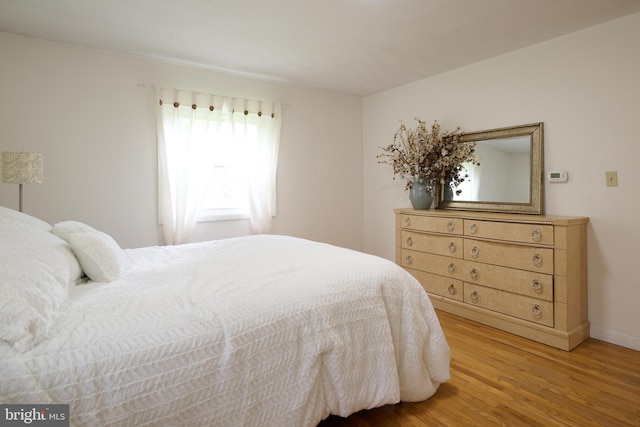 1581 W Branch Rd, State College, PA 16801 - bedroom with light wood-style floors and baseboards