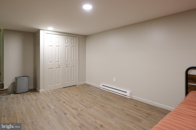1581 W Branch Rd, State College, PA 16801 - unfurnished bedroom with a baseboard heating unit, recessed lighting, wood finished floors, baseboards, and a closet