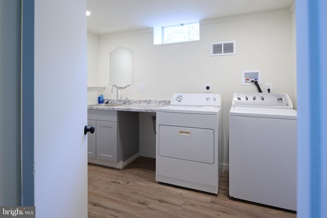 1581 W Branch Rd, State College, PA 16801 - laundry area with a sink, washing machine and clothes dryer, and wood finished floors