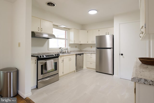 1581 W Branch Rd, State College, PA 16801 - kitchen with stainless steel appliances, under cabinet range hood, light countertops, a sink, and white cabinets