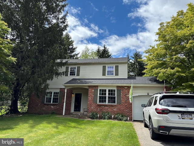 408 W Bristol Rd, Southampton, PA 18966 - traditional-style house featuring an attached garage, brick siding, a front yard, and driveway