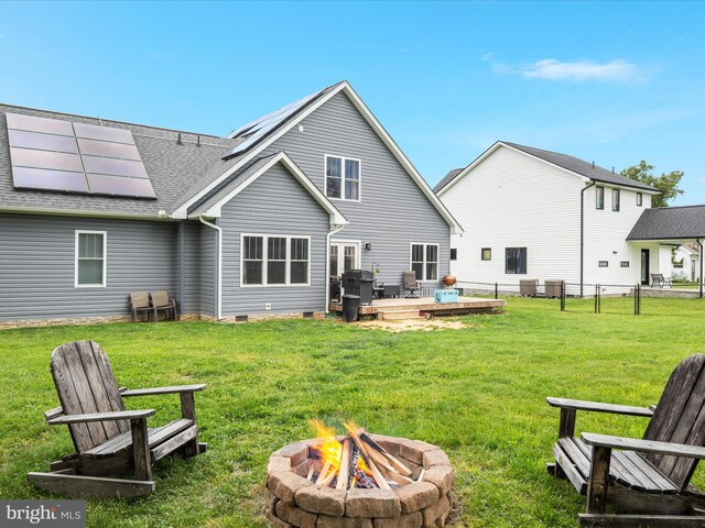 215 S Virginia St, Strasburg, VA 22657 - rear view of house featuring a fire pit, solar panels, crawl space, a shingled roof, and a deck