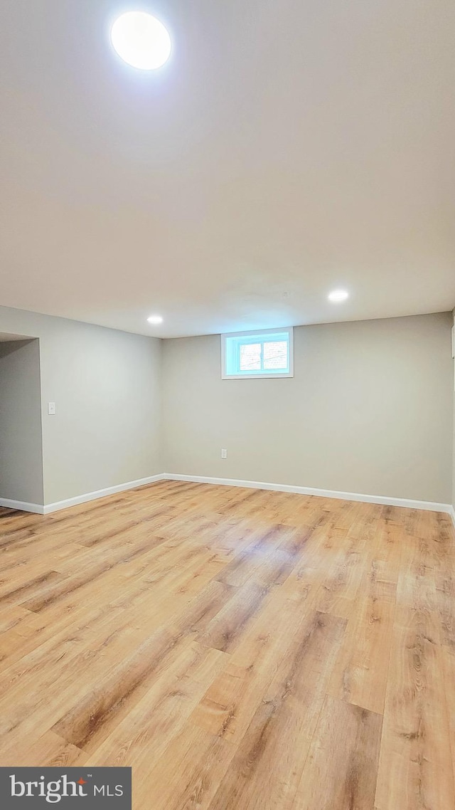 139 Wilmington Pl SE, Washington, DC 20032 - below grade area featuring wood finished floors and baseboards