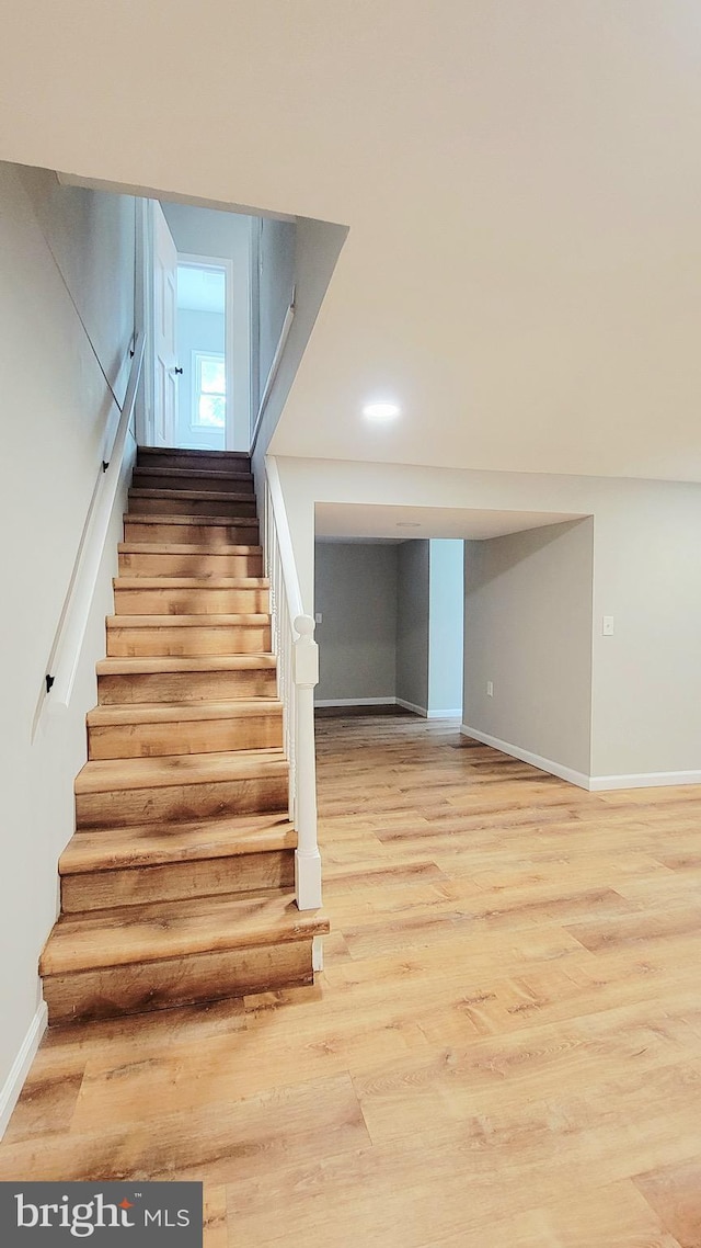 139 Wilmington Pl SE, Washington, DC 20032 - stairs featuring wood finished floors and baseboards