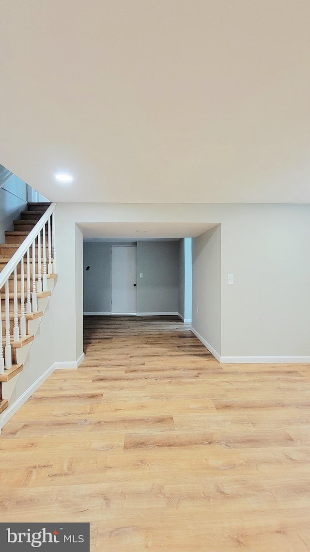 139 Wilmington Pl SE, Washington, DC 20032 - spare room with baseboards, wood finished floors, and stairway