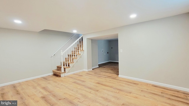 139 Wilmington Pl SE, Washington, DC 20032 - finished basement featuring wood finished floors, baseboards, stairway, and recessed lighting