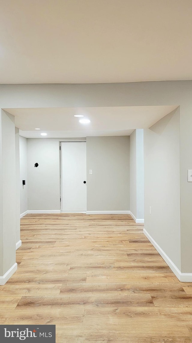 139 Wilmington Pl SE, Washington, DC 20032 - below grade area featuring baseboards, light wood finished floors, and recessed lighting