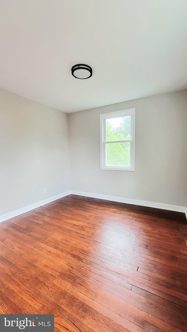 139 Wilmington Pl SE, Washington, DC 20032 - spare room featuring hardwood / wood-style floors and baseboards