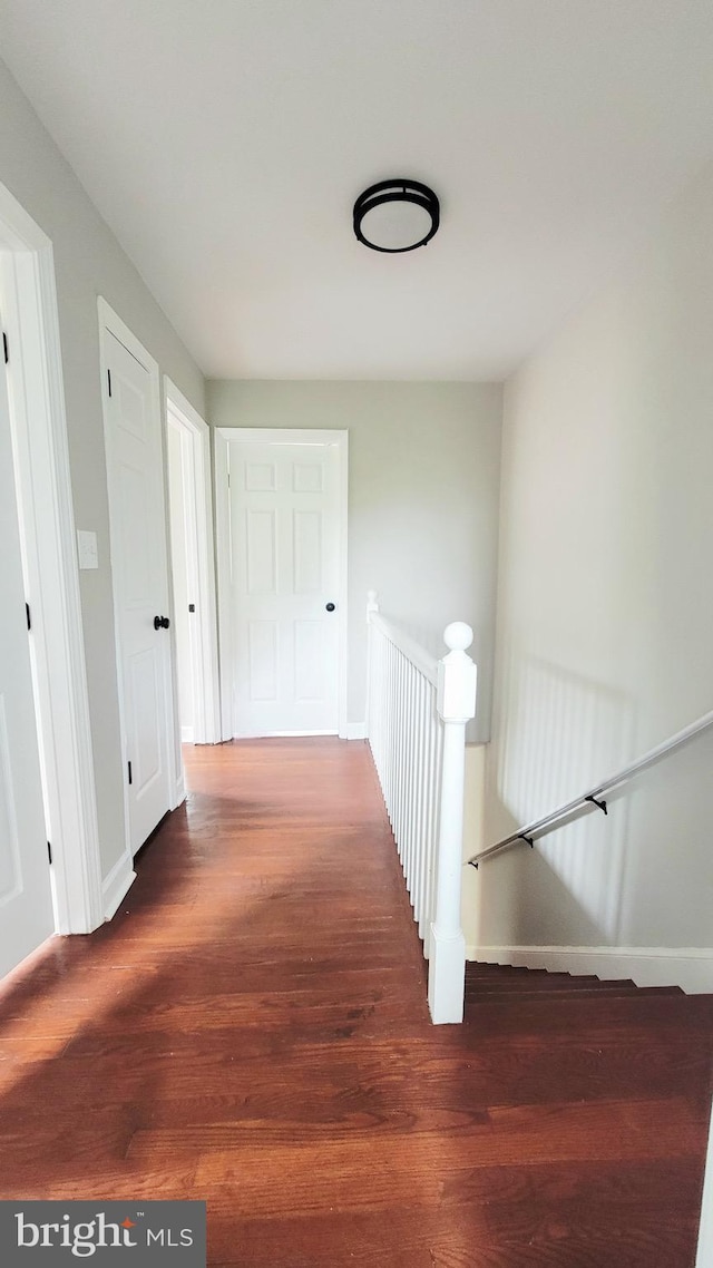 139 Wilmington Pl SE, Washington, DC 20032 - corridor featuring wood finished floors, an upstairs landing, and baseboards
