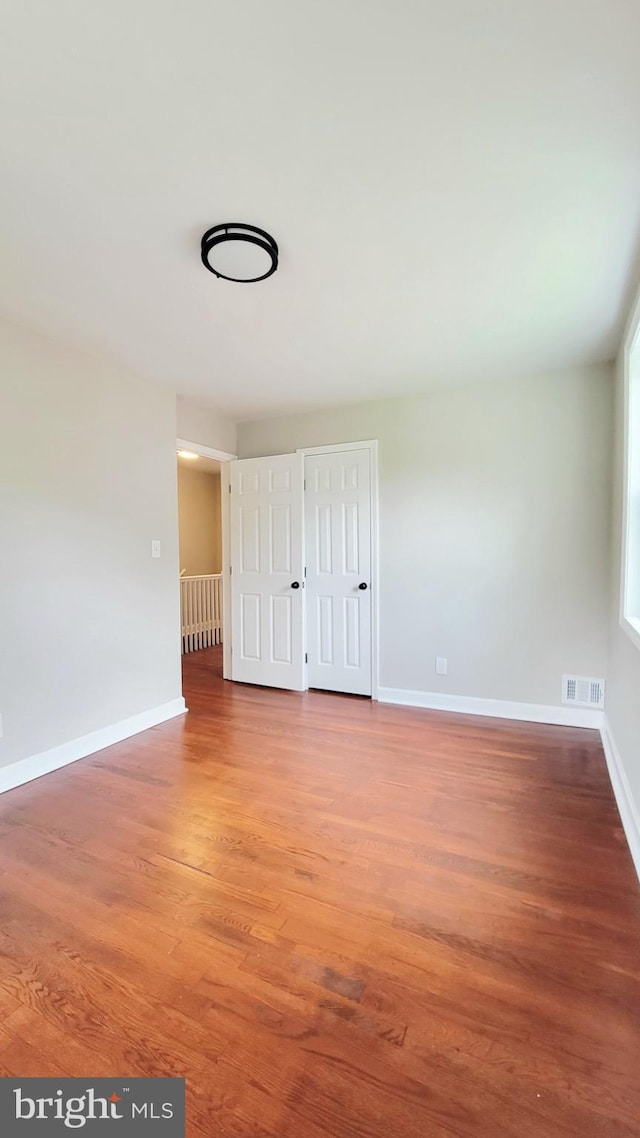 139 Wilmington Pl SE, Washington, DC 20032 - empty room with wood finished floors and baseboards
