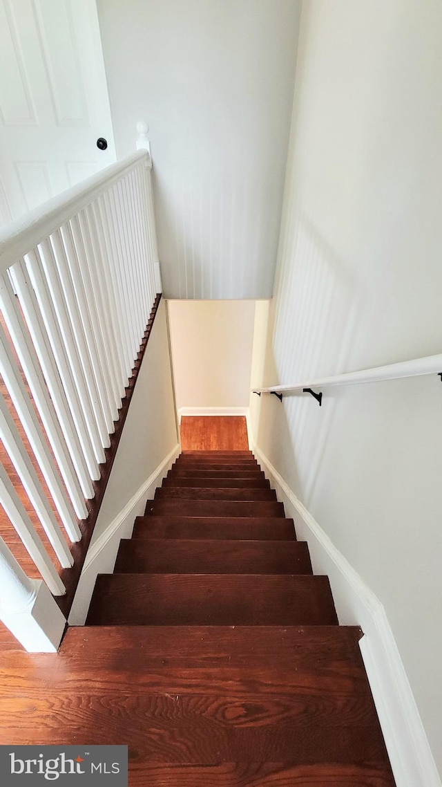 139 Wilmington Pl SE, Washington, DC 20032 - stairway featuring baseboards and wood finished floors