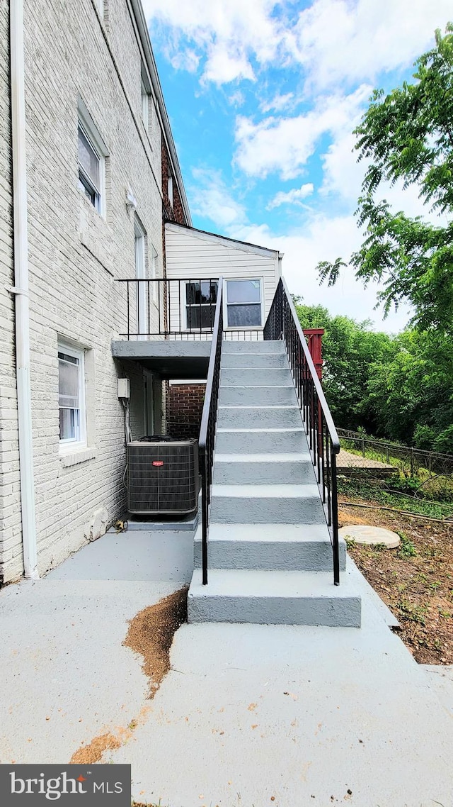 139 Wilmington Pl SE, Washington, DC 20032 - exterior space with cooling unit and brick siding