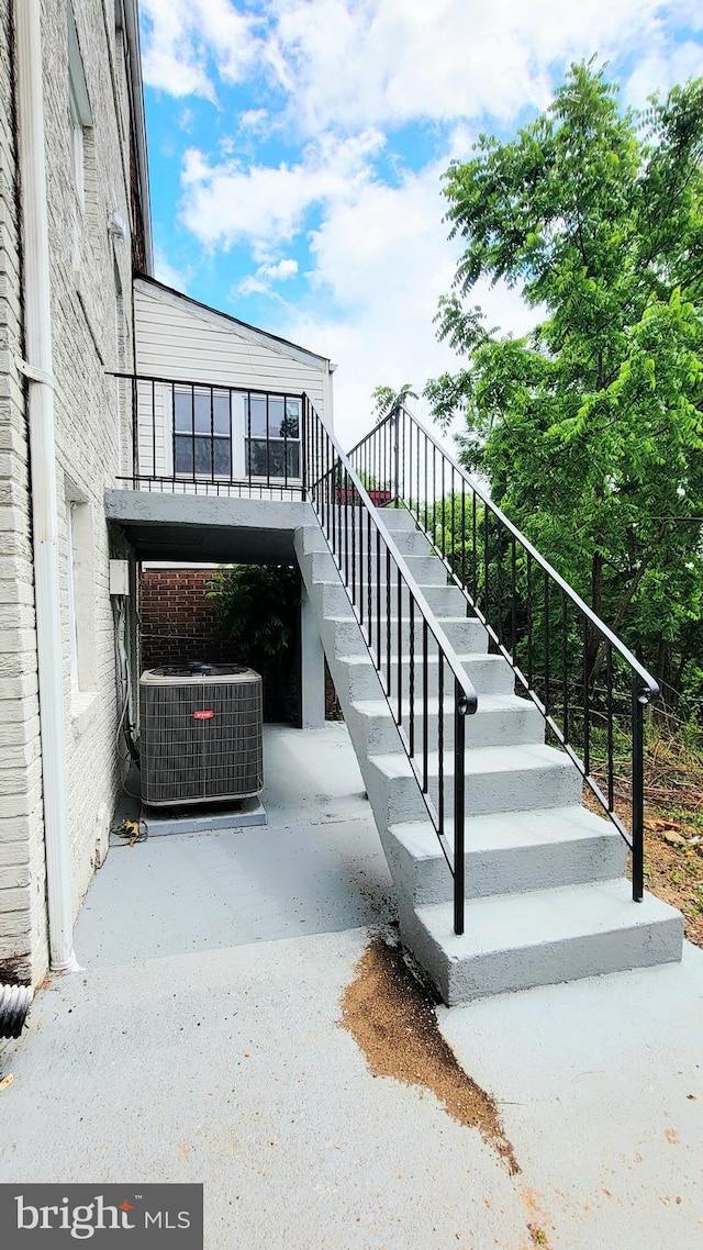 139 Wilmington Pl SE, Washington, DC 20032 - view of patio / terrace with central air condition unit and stairway