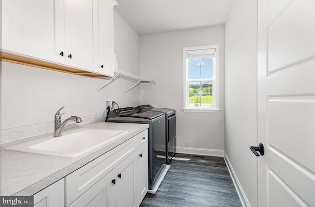 220 Moorefield St, Mechanicsburg, PA 17055 - laundry room featuring washer and dryer, cabinet space, baseboards, and dark wood-style floors