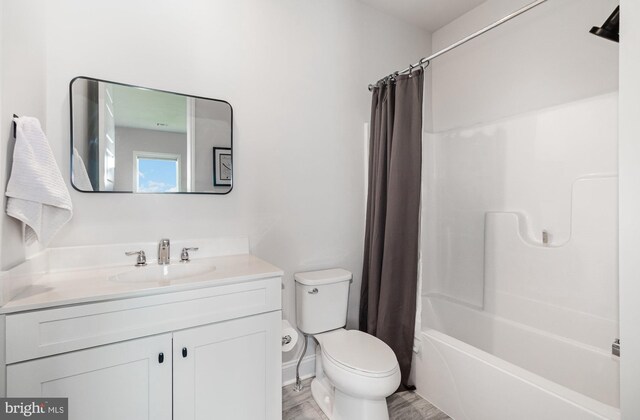 220 Moorefield St, Mechanicsburg, PA 17055 - bathroom with toilet, vanity, shower / bath combo, and wood finished floors