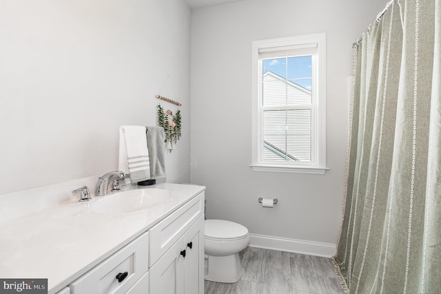 220 Moorefield St, Mechanicsburg, PA 17055 - bathroom featuring toilet, vanity, and baseboards