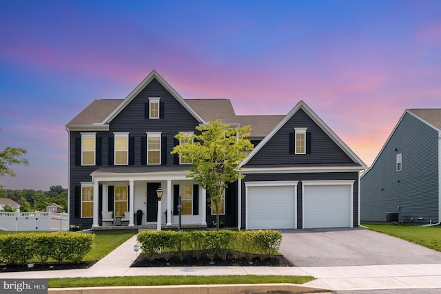 220 Moorefield St, Mechanicsburg, PA 17055 - view of front facade featuring a porch, asphalt driveway, an attached garage, and a shingled roof