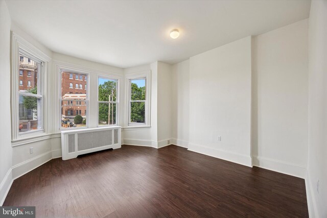 5324 Cedar Ave, Philadelphia, PA 19143 - spare room featuring radiator heating unit, baseboards, and dark wood-style flooring