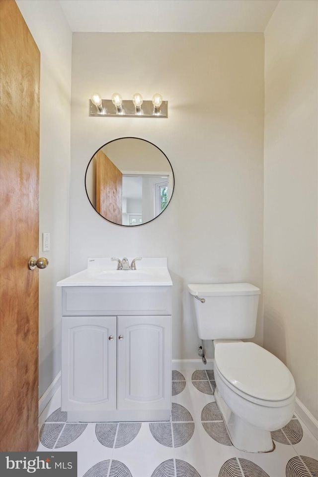 5324 Cedar Ave, Philadelphia, PA 19143 - bathroom featuring baseboards, toilet, vanity, and tile patterned floors