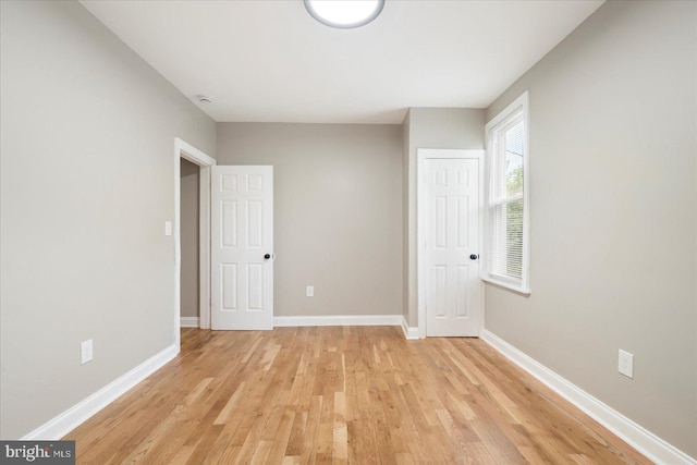 1202 Dukeland St, Baltimore, MD 21216 - empty room with light wood-style floors and baseboards