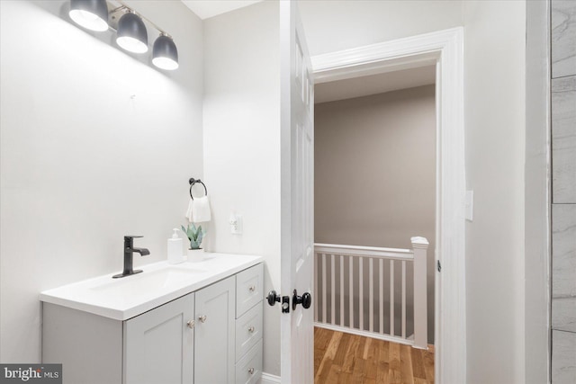 1202 Dukeland St, Baltimore, MD 21216 - bathroom featuring vanity and wood finished floors