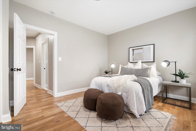 1202 Dukeland St, Baltimore, MD 21216 - bedroom featuring light wood-type flooring and baseboards