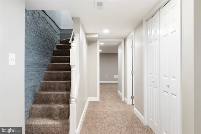 1202 Dukeland St, Baltimore, MD 21216 - stairs featuring carpet floors and baseboards