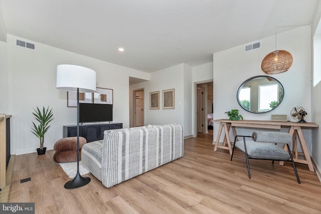 714 Iron Frg Unit A, Frederick, MD 21702 - living room featuring light wood-style floors, baseboards, and recessed lighting