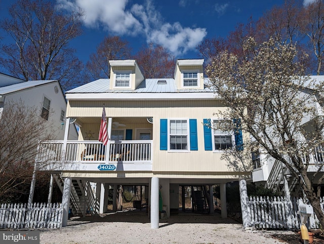34020 Cypress Ln Unit 136, Frankford, DE 19945 - coastal home with covered porch, a carport, stairs, metal roof, and driveway