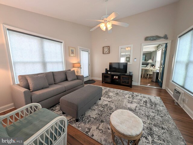 34020 Cypress Ln Unit 136, Frankford, DE 19945 - living area with a wall unit AC, ceiling fan, dark wood finished floors, baseboards, and vaulted ceiling