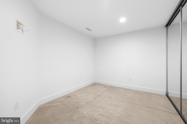 2772 Lighthouse Pt E Unit 101, Baltimore, MD 21224 - spare room with carpet floors, baseboards, and recessed lighting