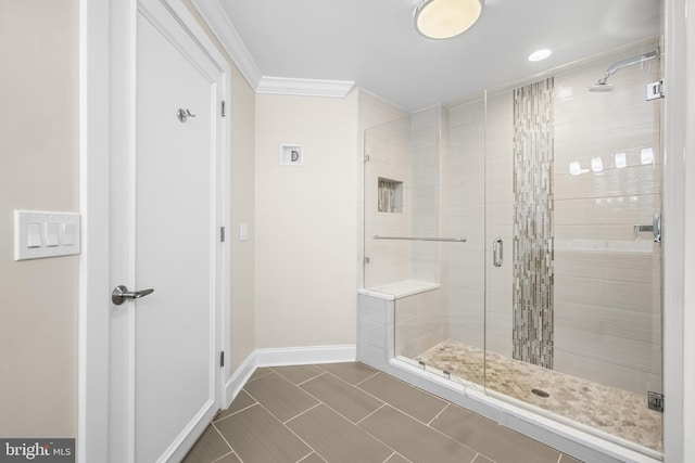 2772 Lighthouse Pt E Unit 101, Baltimore, MD 21224 - full bathroom with a stall shower, baseboards, and ornamental molding