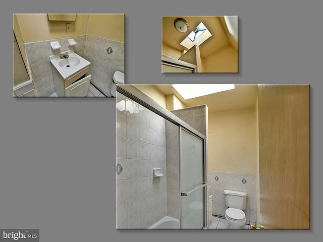 749 Bartlett Ave, Baltimore, MD 21218 - full bathroom with tile walls, toilet, wainscoting, vanity, and a skylight
