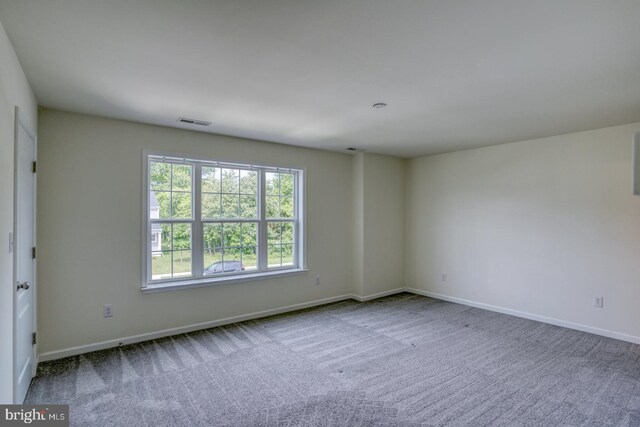 217 Tea Party Trl, Dover, DE 19901 - carpeted empty room with baseboards