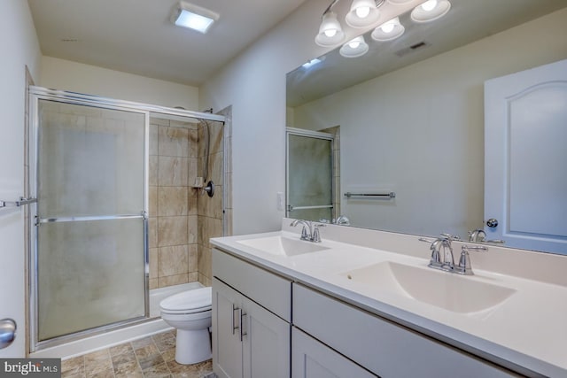 217 Tea Party Trl, Dover, DE 19901 - bathroom featuring toilet, a shower stall, and double vanity