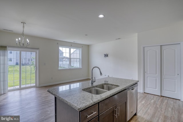217 Tea Party Trl, Dover, DE 19901 - kitchen with a sink, dishwasher, light wood-style floors, a chandelier, and baseboards