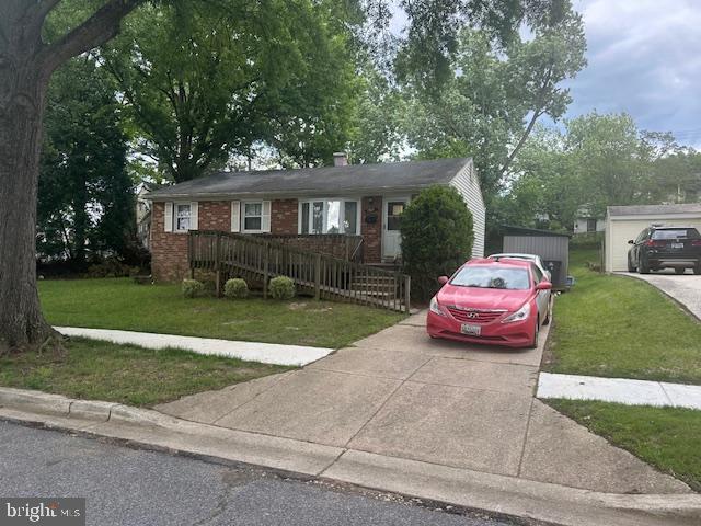 7507 Vanessa Ct, Lanham, MD 20706 - ranch-style house with a front yard, brick siding, and concrete driveway