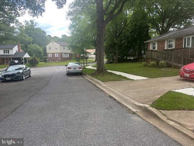 7507 Vanessa Ct, Lanham, MD 20706 - view of asphalt street featuring curbs, sidewalks, and a residential view