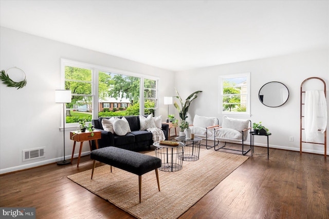 8511 Valleyfield Rd, Lutherville Timonium, MD 21093 - living room featuring baseboards, healthy amount of natural light, and wood finished floors