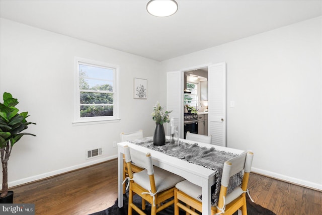8511 Valleyfield Rd, Lutherville Timonium, MD 21093 - dining room with baseboards and dark wood-style flooring