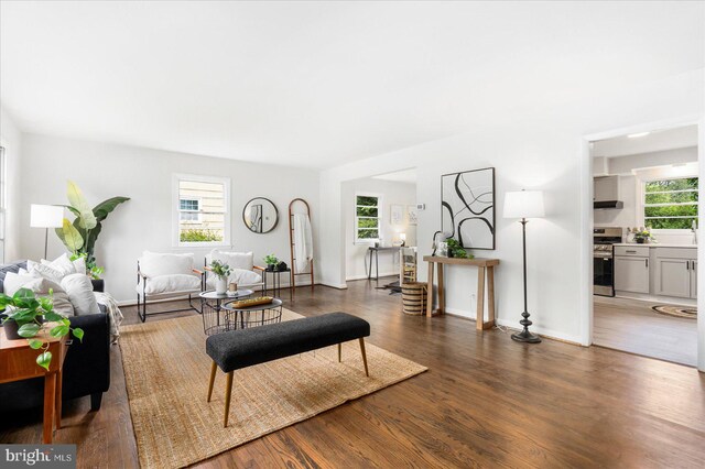 8511 Valleyfield Rd, Lutherville Timonium, MD 21093 - living area featuring plenty of natural light, wood finished floors, and baseboards