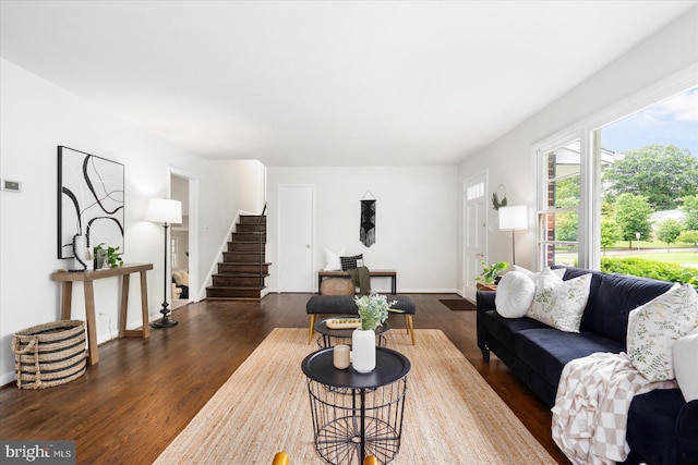 8511 Valleyfield Rd, Lutherville Timonium, MD 21093 - living room with dark wood-style flooring, stairway, and baseboards