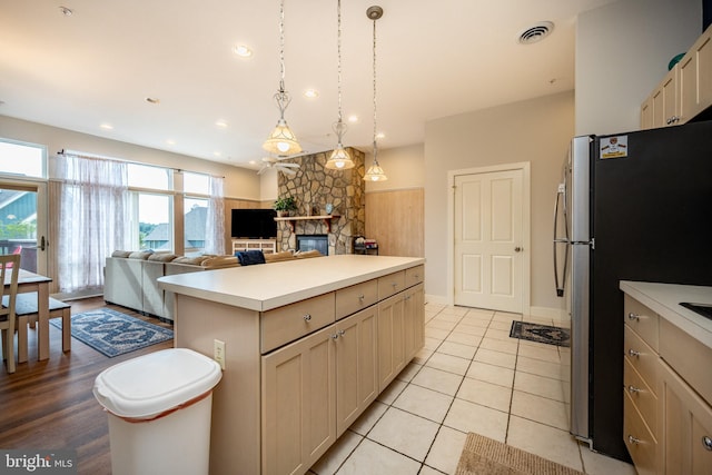 1278 Deep Creek Dr Unit B3, Mc Henry, MD 21541 - kitchen with freestanding refrigerator, a fireplace, light countertops, a center island, and pendant lighting