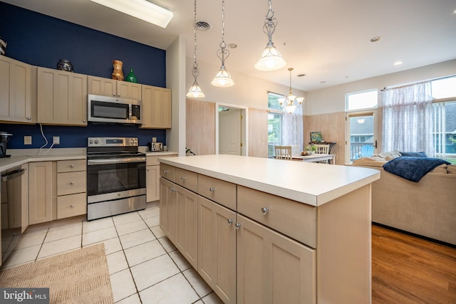 1278 Deep Creek Dr Unit B3, Mc Henry, MD 21541 - kitchen featuring appliances with stainless steel finishes, light countertops, a center island, decorative light fixtures, and open floor plan