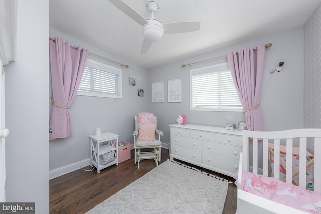 734 Shields, West Deptford, NJ 08096 - bedroom featuring a crib, dark wood finished floors, baseboards, and ceiling fan