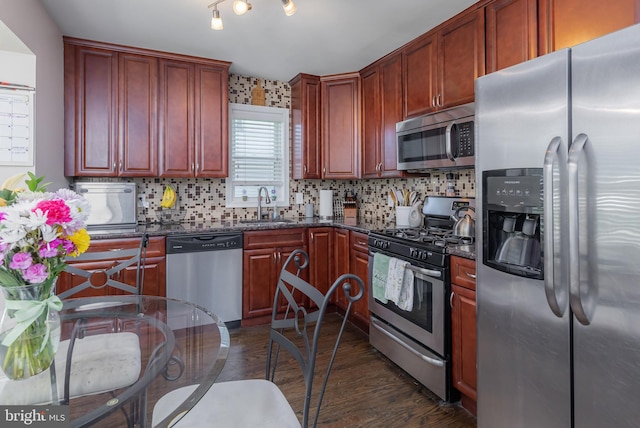 734 Shields, West Deptford, NJ 08096 - kitchen with appliances with stainless steel finishes, a sink, dark wood-type flooring, and backsplash