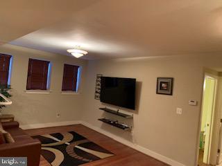2656 15th St NW Unit C4, Washington, DC 20009 - living area featuring baseboards and wood finished floors