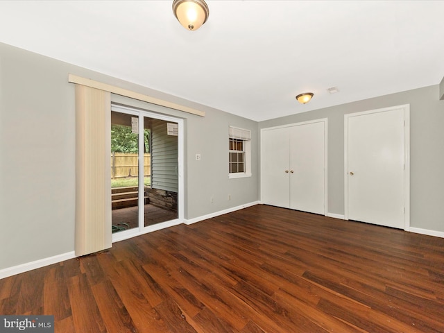1851 Dulaney Ct, Frederick, MD 21702 - unfurnished bedroom with access to outside, wood finished floors, baseboards, and two closets